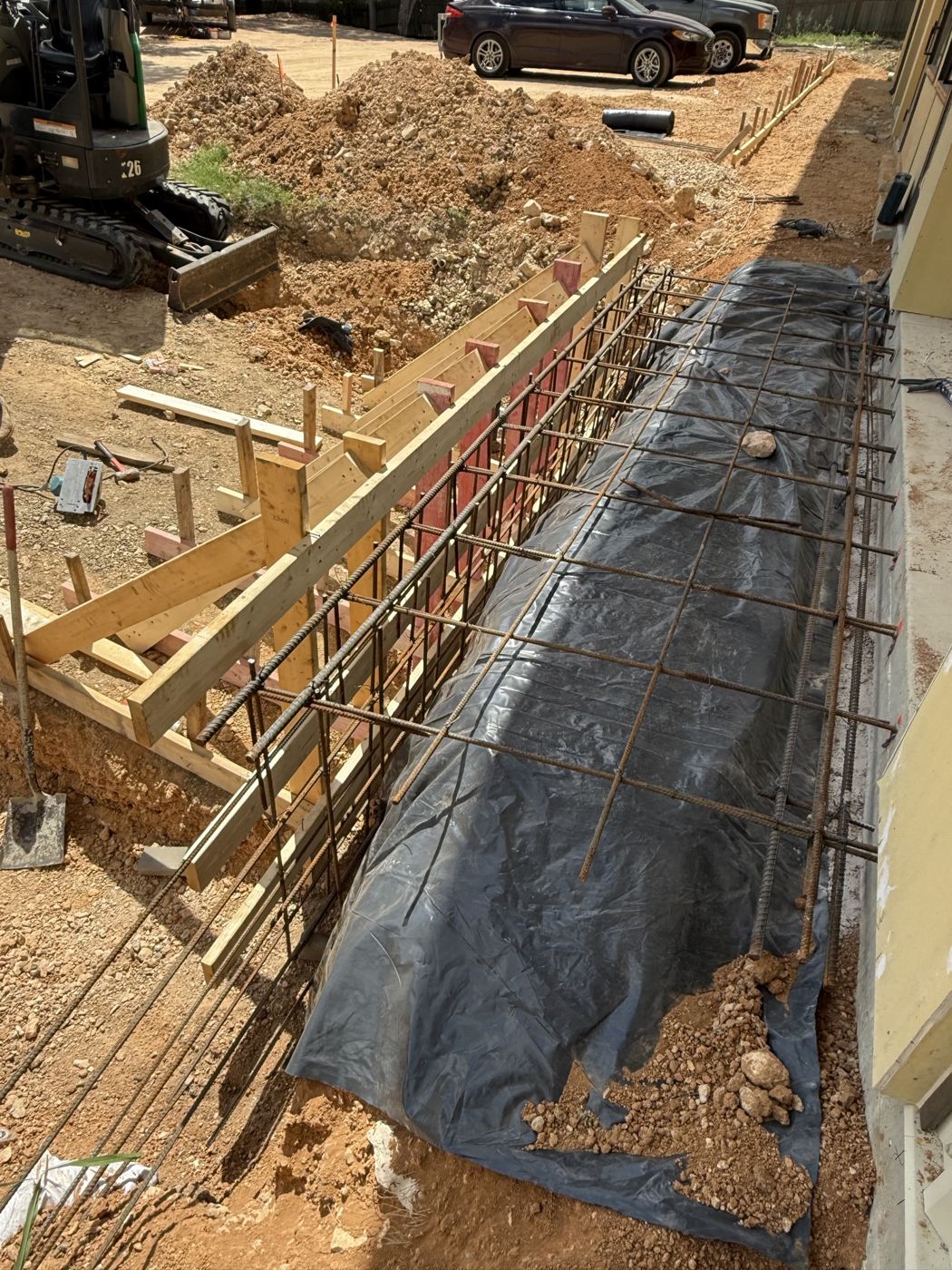 Wall footing with rebar and vapor barrier, Avenue N commercial site work