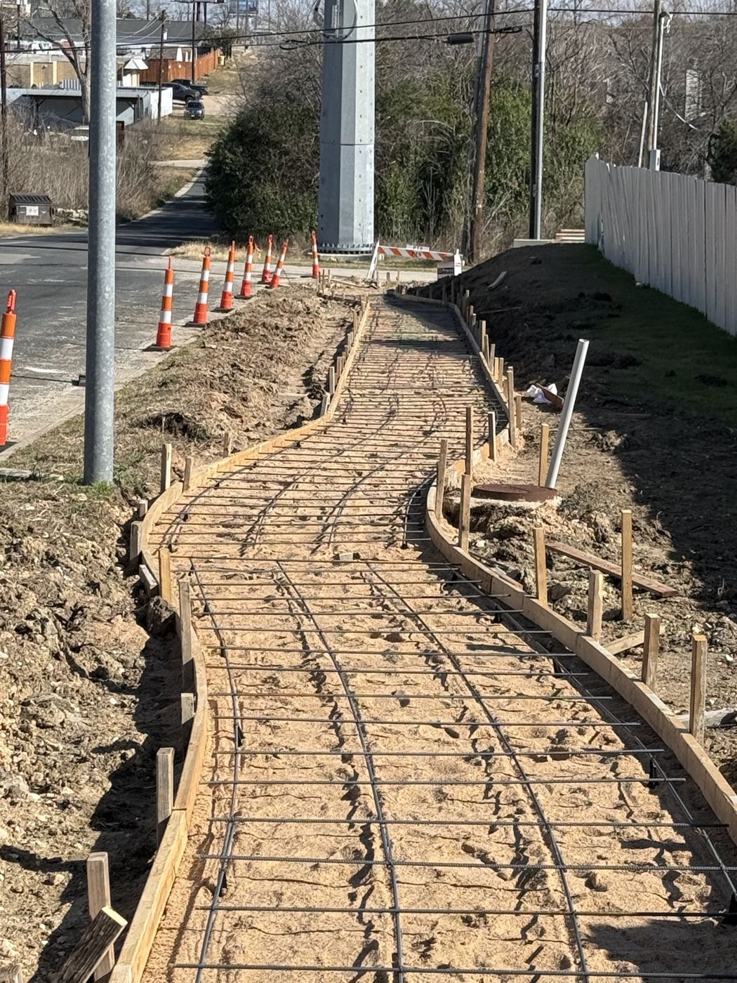 Rebar set in a curved sidewalk, Avenue N commercial site work