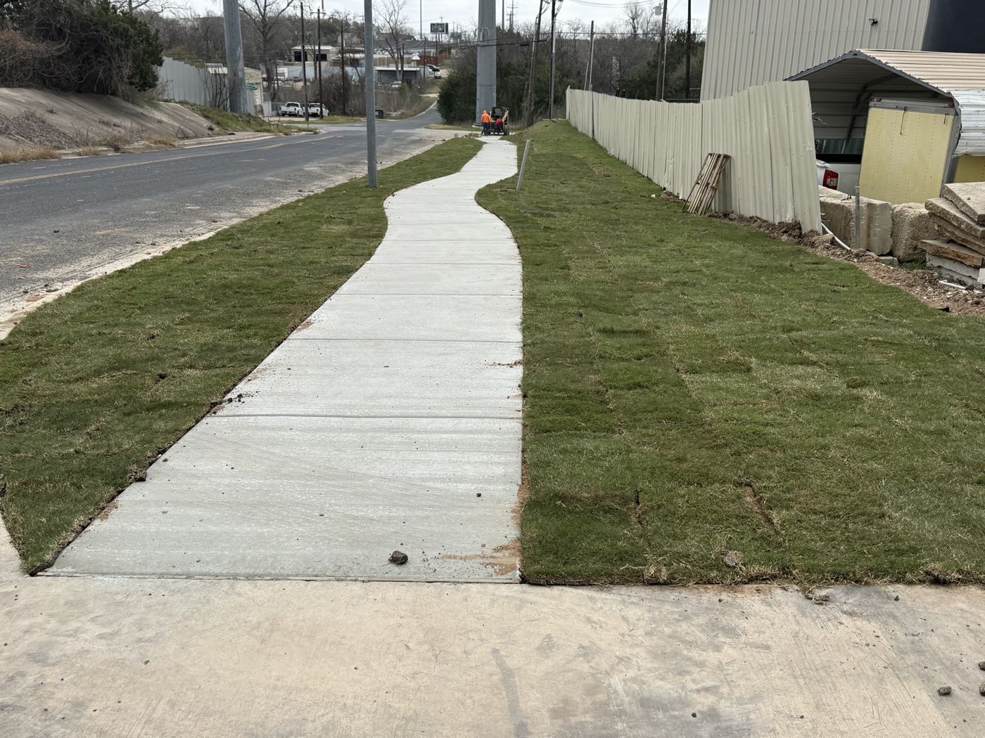 Finished sidewalk with new sod, Avenue N commercial site work