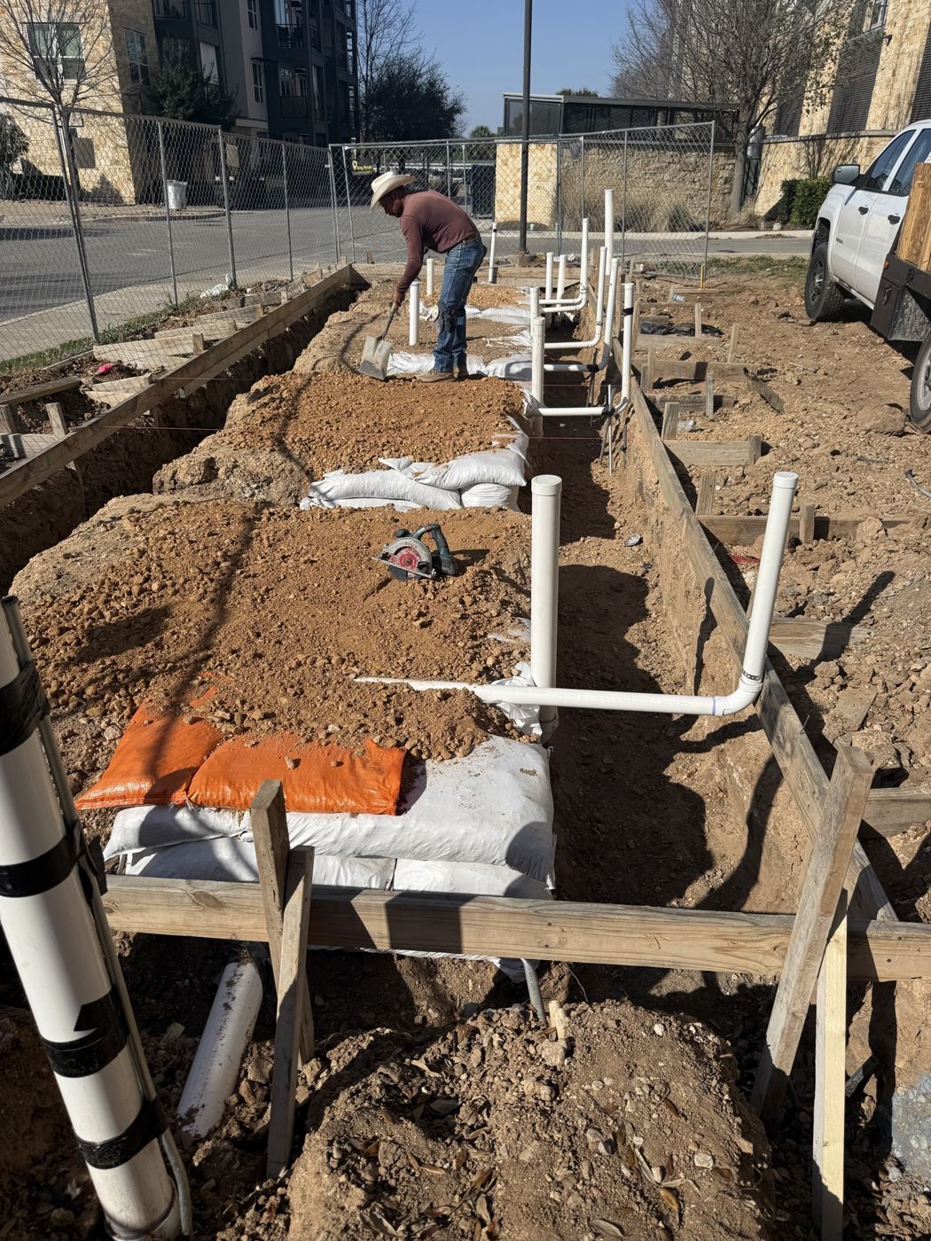 Underground plumbing rough-in in the trenches, Wahoo's Fish Tacos South Shore build in Austin