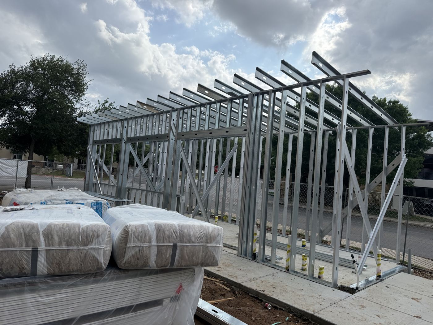 Framed walls with materials staged, Wahoo's Fish Tacos South Shore build in Austin