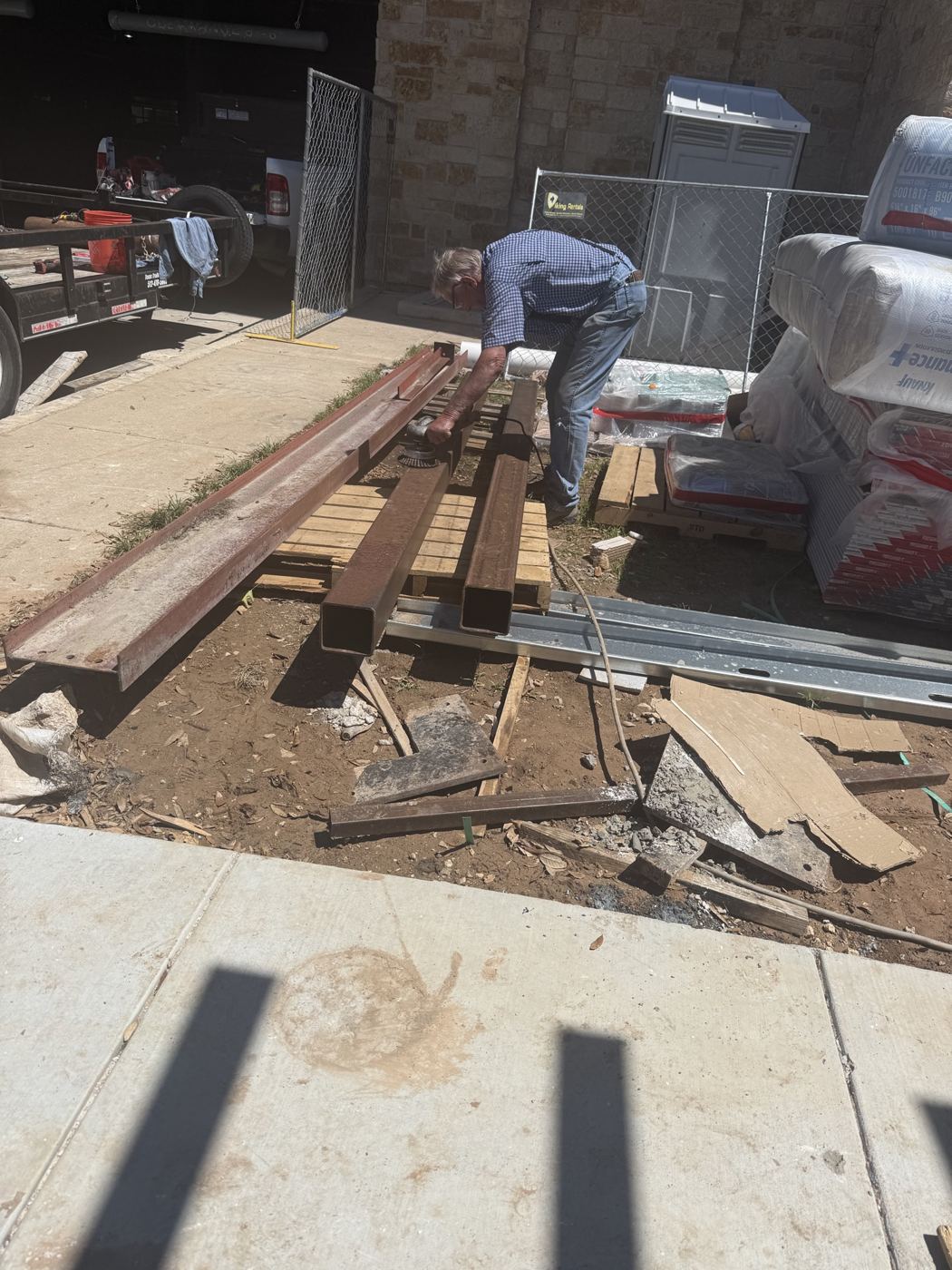 Crew cutting framing lumber on site, Wahoo's Fish Tacos South Shore build in Austin
