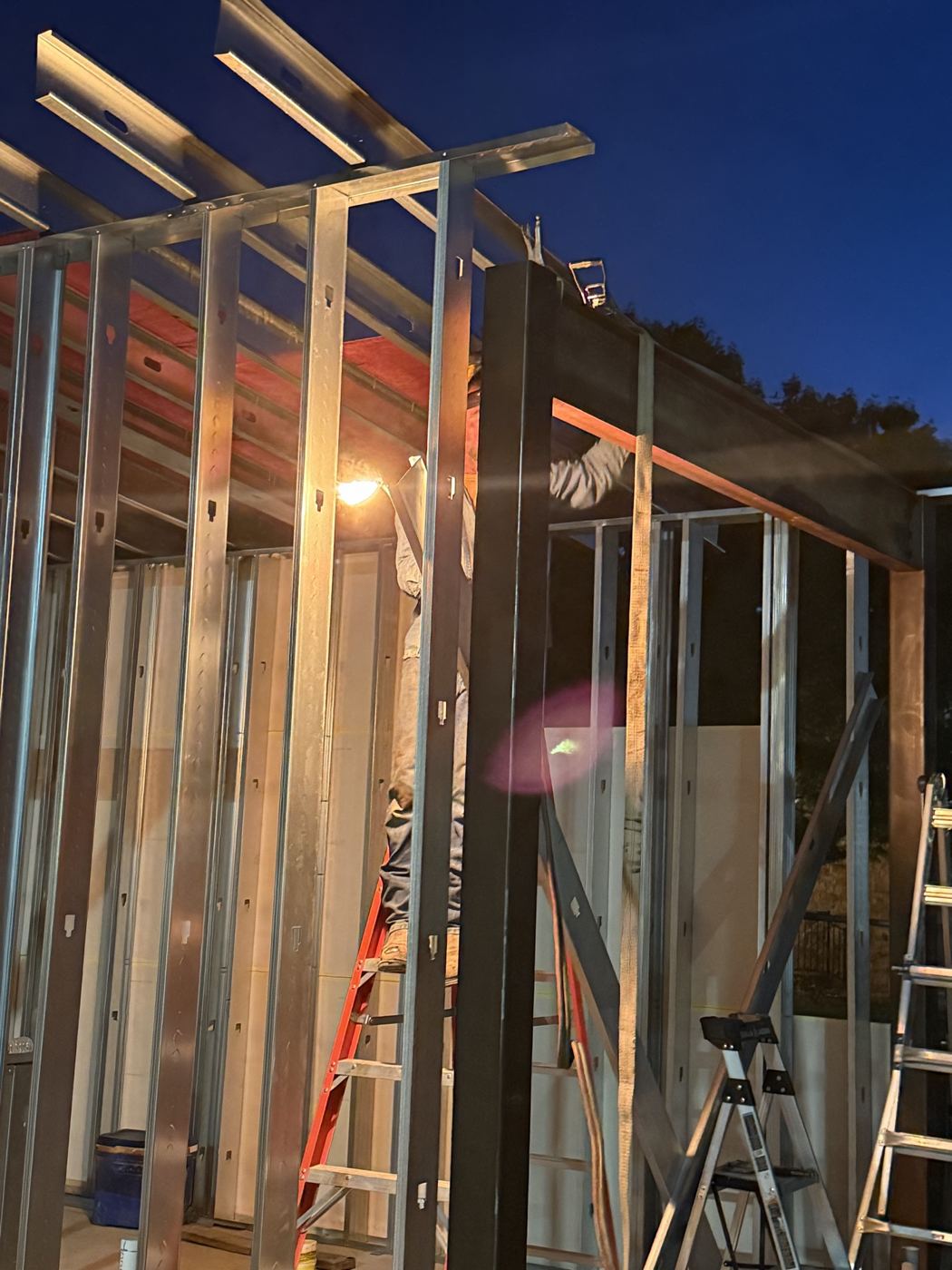Framing at dusk, Wahoo's Fish Tacos South Shore build in Austin