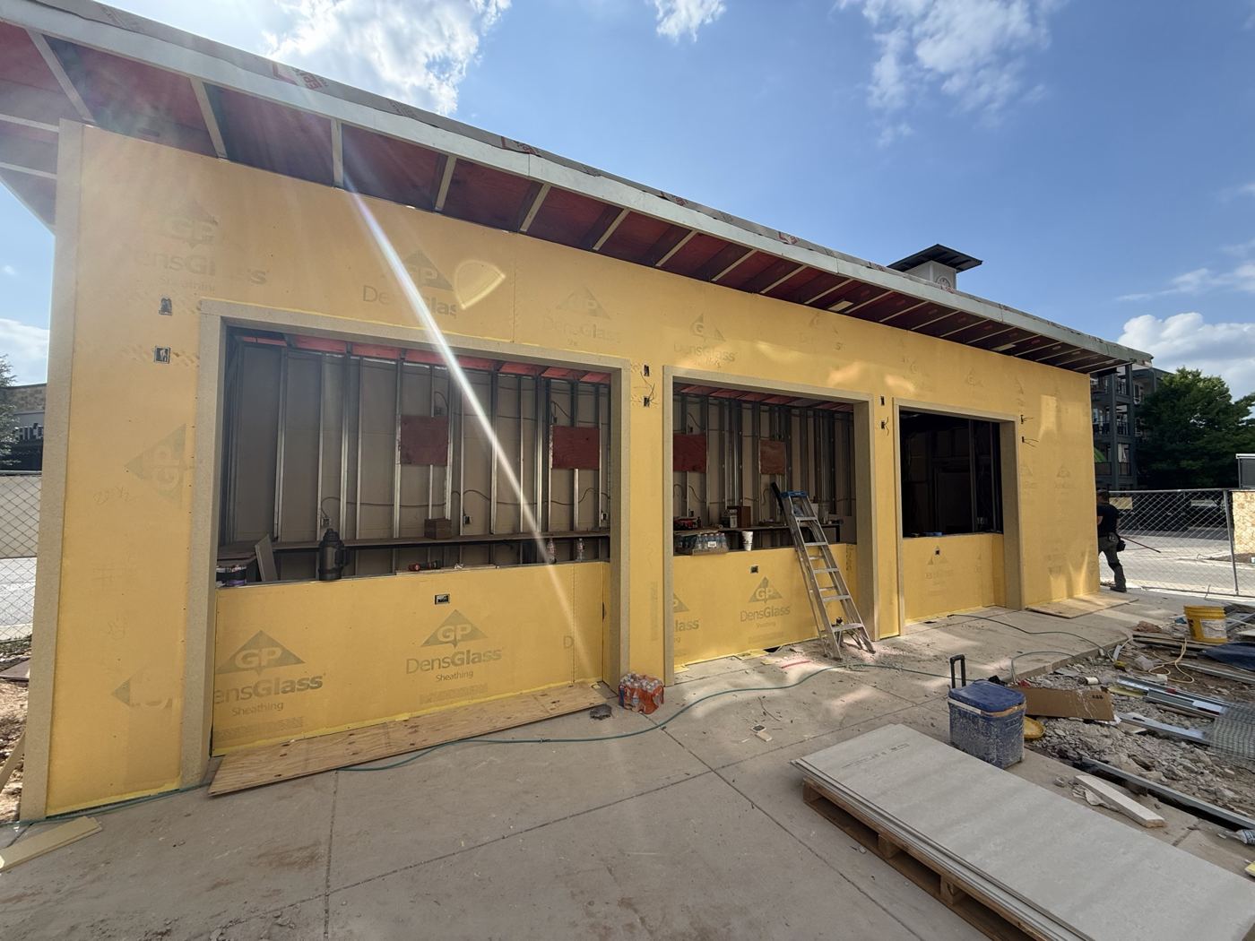 Sheathed and wrapped building with bar openings, Wahoo's Fish Tacos South Shore build in Austin