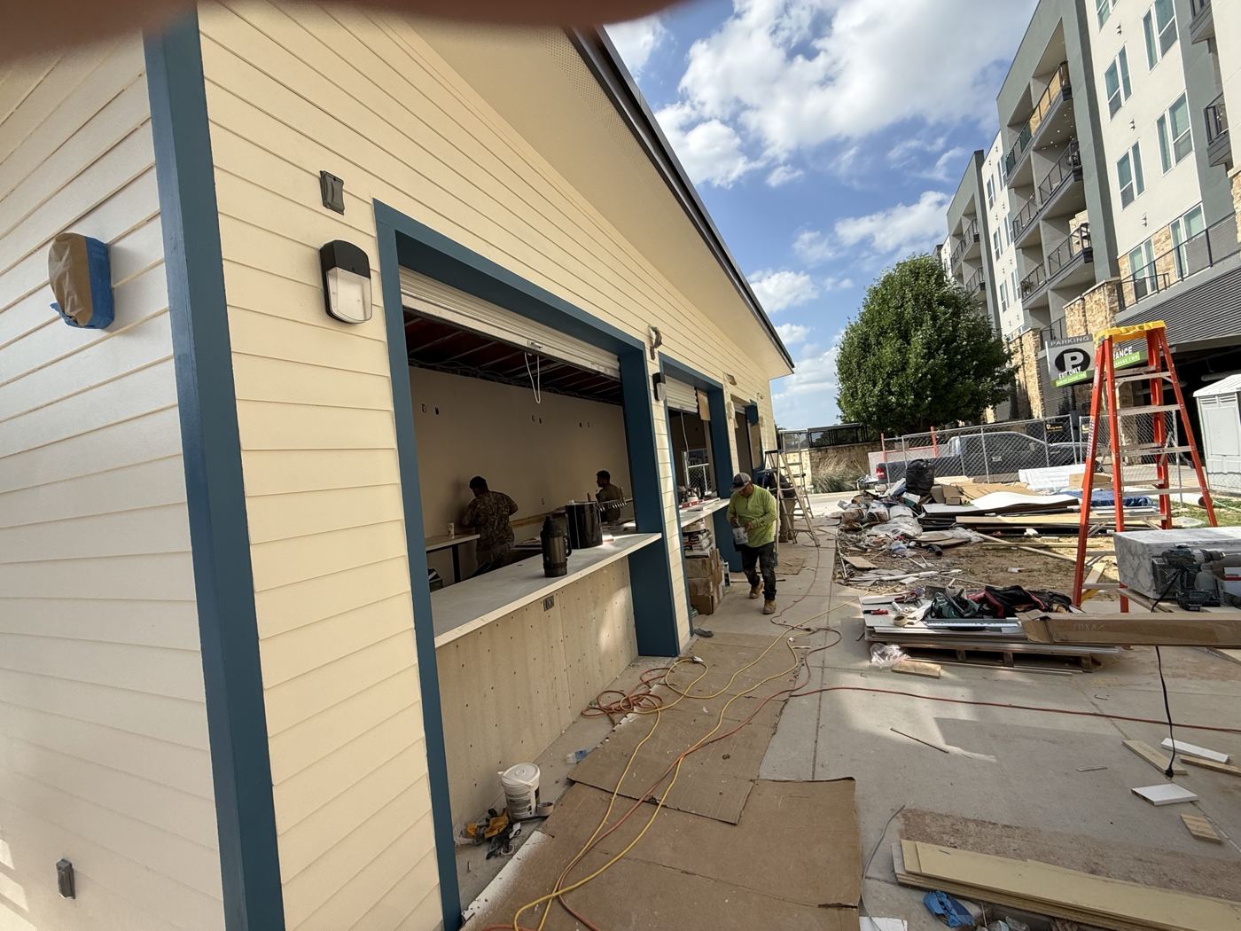 Siding and trim going on, Wahoo's Fish Tacos South Shore build in Austin