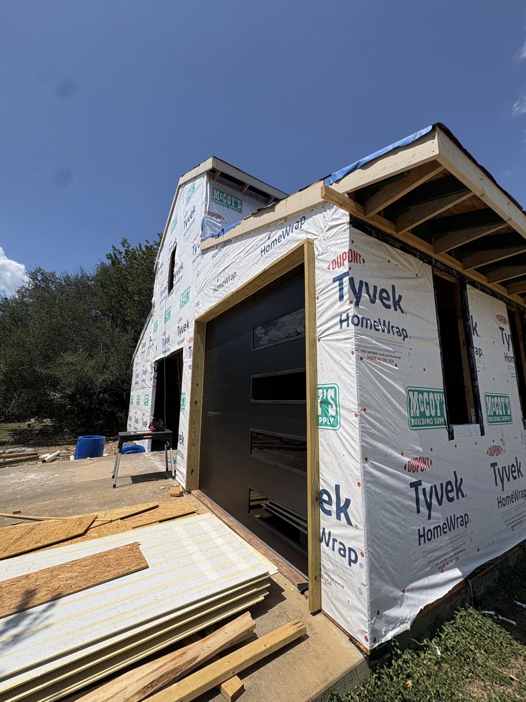 New garage door opening and wrapped walls, barn remodel on El Viejo Camino in Austin