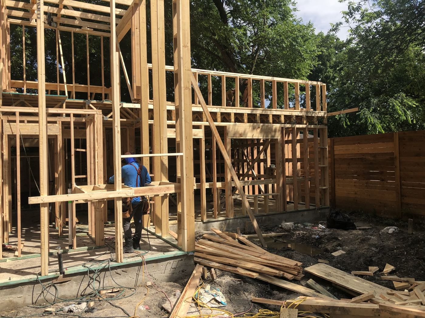 Wall framing on the first floor, Vargas Street condos design-build in Austin